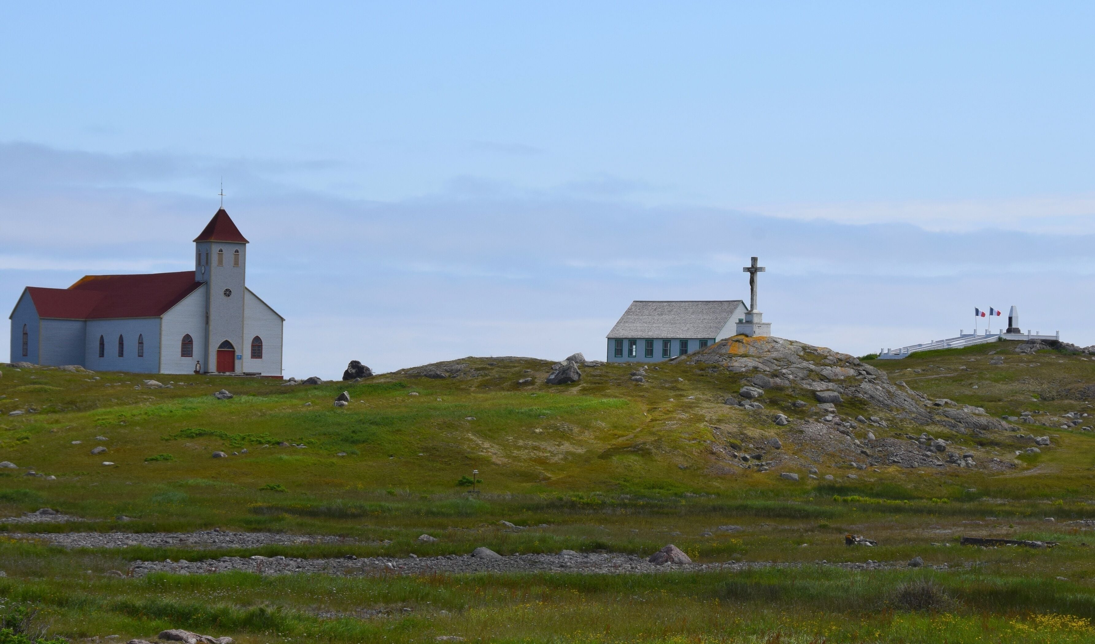 white church with red roof on Ile aux Marin, Saint Pierre and Miquelon
