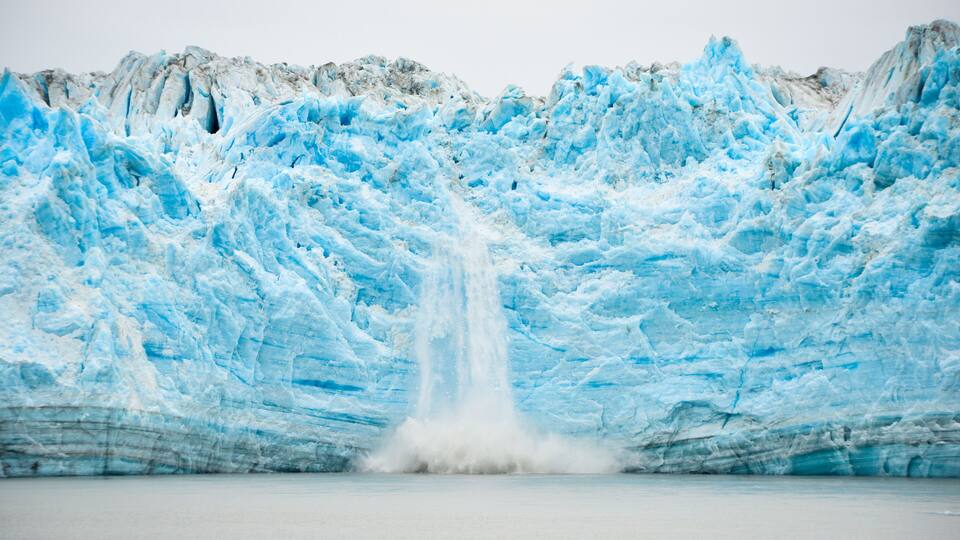 A glacier with a waterfall.
