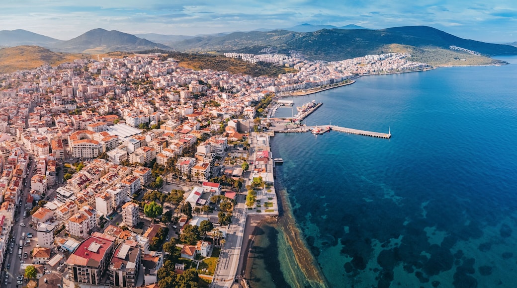 Drone panorama capturing the beauty of Dikili, a coastal town in Turkey, showcasing its colorful buildings, harbor, and the clear Aegean Sea