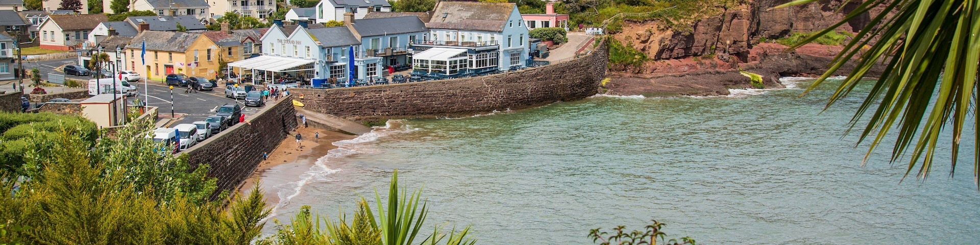 Dunmore East featuring rugged coastline and a coastal town