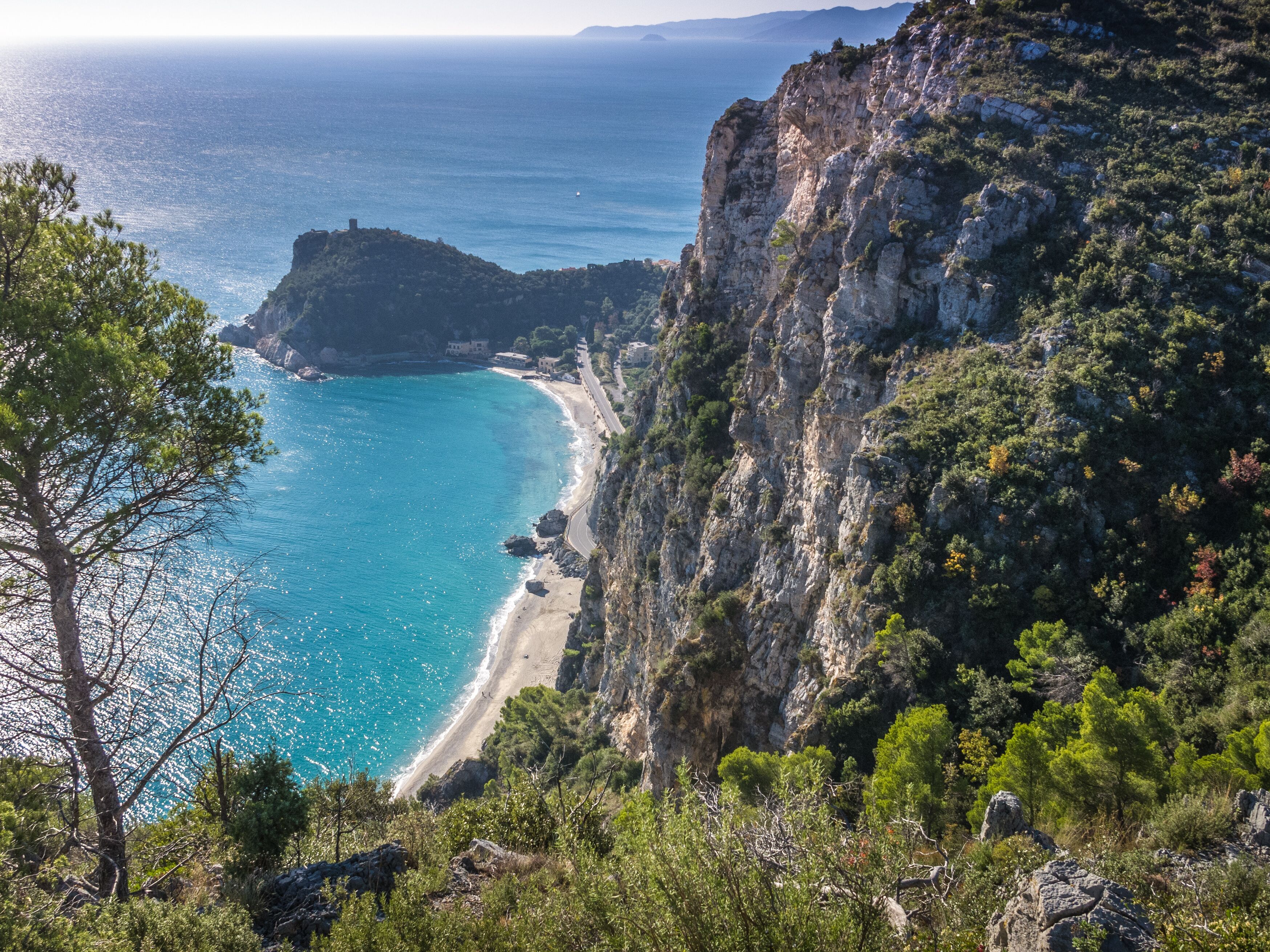 Beautiful aerial view of Baia dei Saraceni with blue Mediterranean sea and a stone watchtower near Varigotti, quaint fisherman village near Finale Ligure, Savona, Liguria, Italy, Italian Riviera