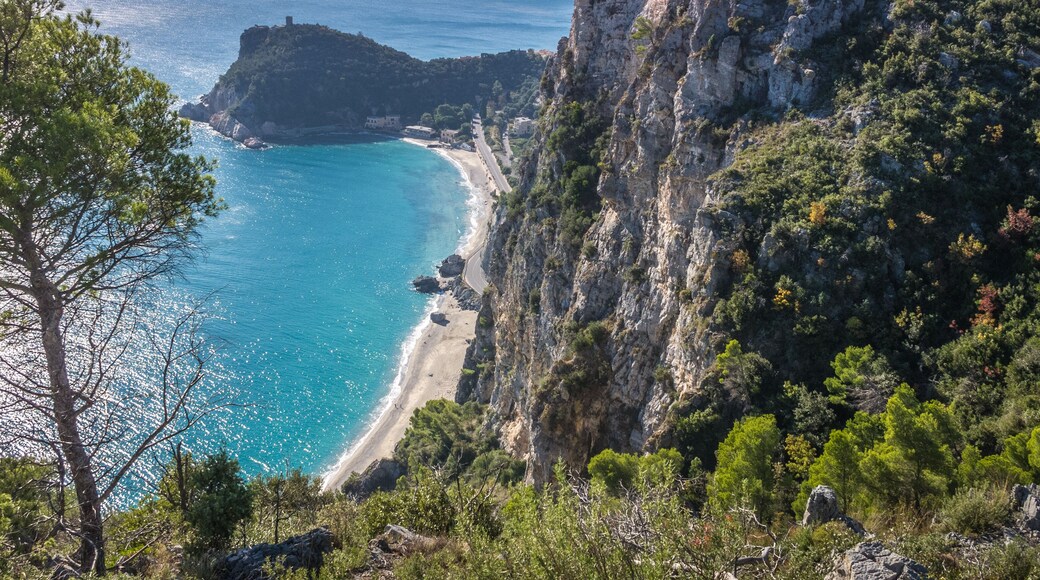 Beautiful aerial view of Baia dei Saraceni with blue Mediterranean sea and a stone watchtower near Varigotti, quaint fisherman village near Finale Ligure, Savona, Liguria, Italy, Italian Riviera