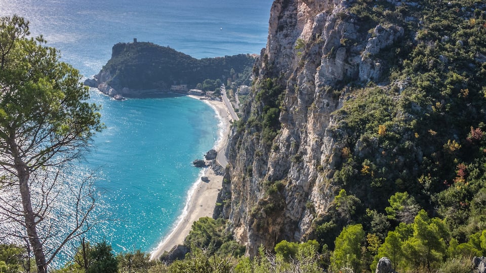 Beautiful aerial view of Baia dei Saraceni with blue Mediterranean sea and a stone watchtower near Varigotti, quaint fisherman village near Finale Ligure, Savona, Liguria, Italy, Italian Riviera