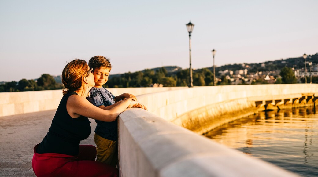Mother and son enjoying the sunset in Argostoli, Kefalonia, Greece.