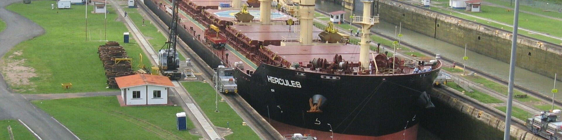 This ship is just entering the first lock of Miraflores Locks. The ships wait in the bay near Amador Causeway until a Panamanian captain is taken out to them. Only Panamanian captains may steer a ship through the canal. www.panamaroadrunner.com