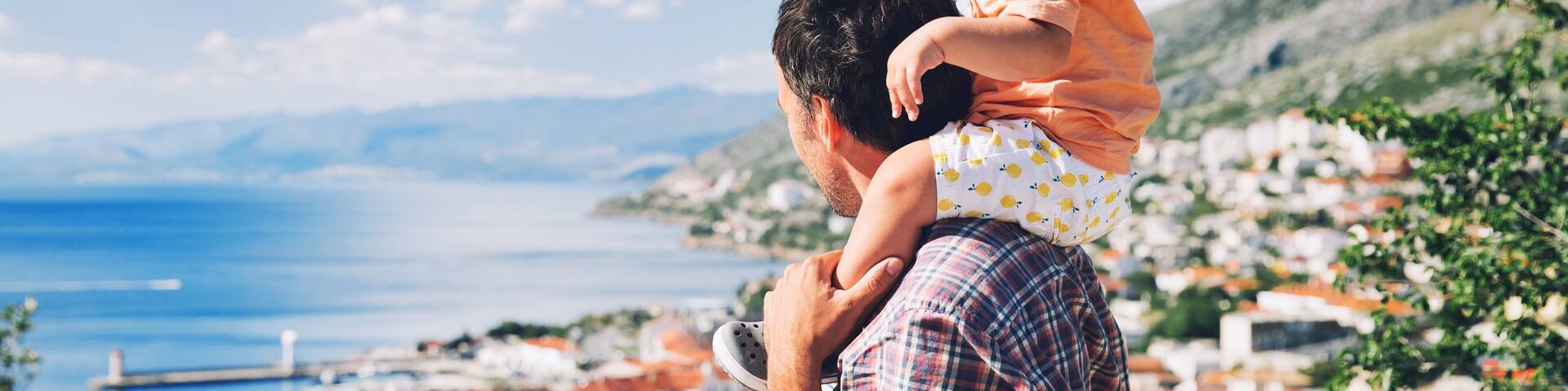 Father and son on backgrounds of the Croatian seacoast.