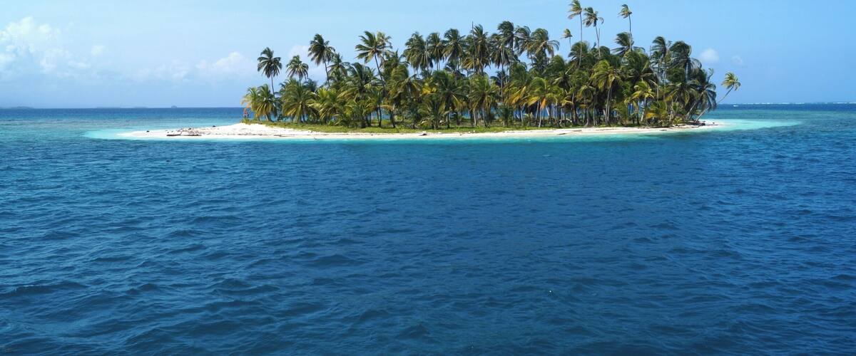 One of the many tiny islets of San Blas. Best to be explored on a sailing cruise from Panama to Colombia.