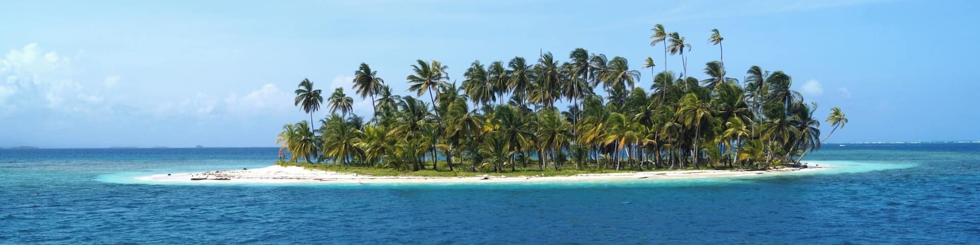 One of the many tiny islets of San Blas. Best to be explored on a sailing cruise from Panama to Colombia.