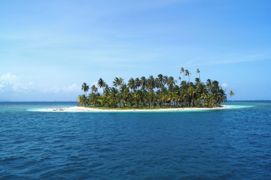 One of the many tiny islets of San Blas. Best to be explored on a sailing cruise from Panama to Colombia.