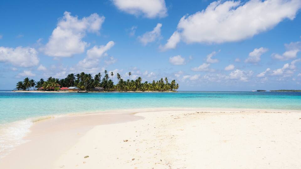 View of turquoise sea with island from Isla de Perro island in Caribbean See