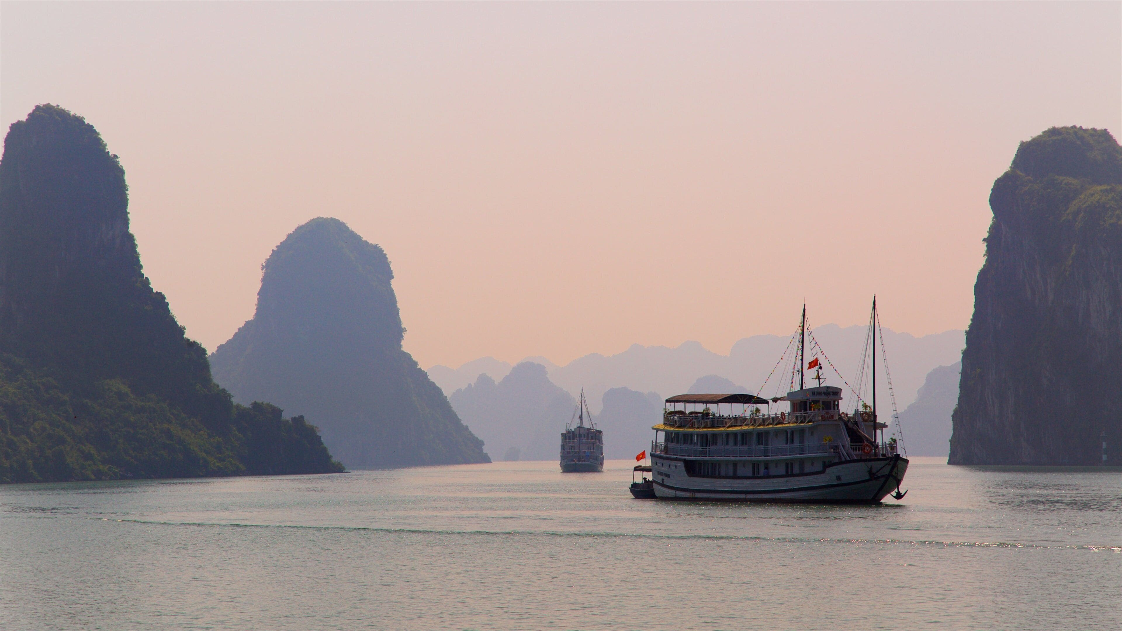 Vietnam which includes general coastal views, a sunset and cruising