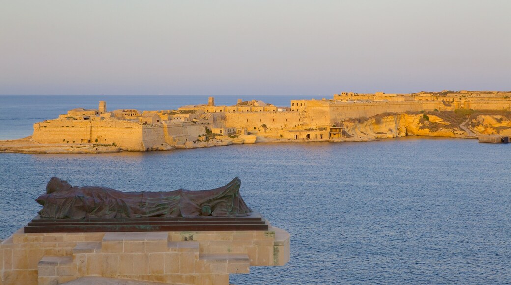 Grand Harbour showing a sunset, a coastal town and a bay or harbour