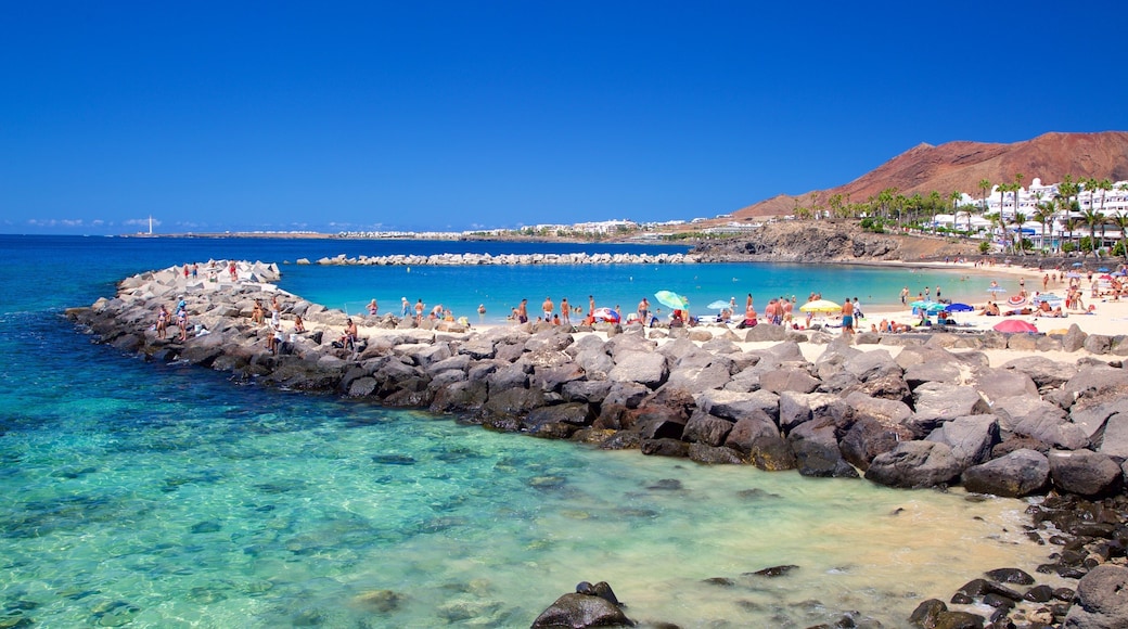 Playa Blanca which includes general coastal views and a sandy beach