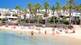 Playa Blanca welches beinhaltet allgemeine Küstenansicht, Küstenort und Strand