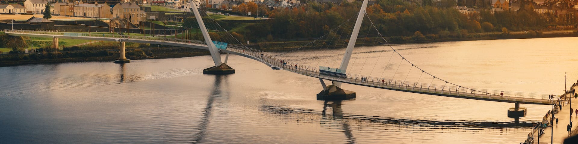 Peace bridge Derry Londonderry and river Foyle