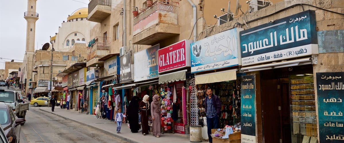 A street with shops and a mosque.