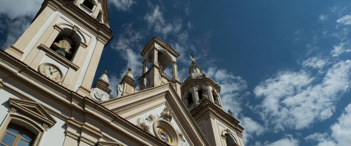 A historic building with ornate architecture, including a clock tower and decorative elements.