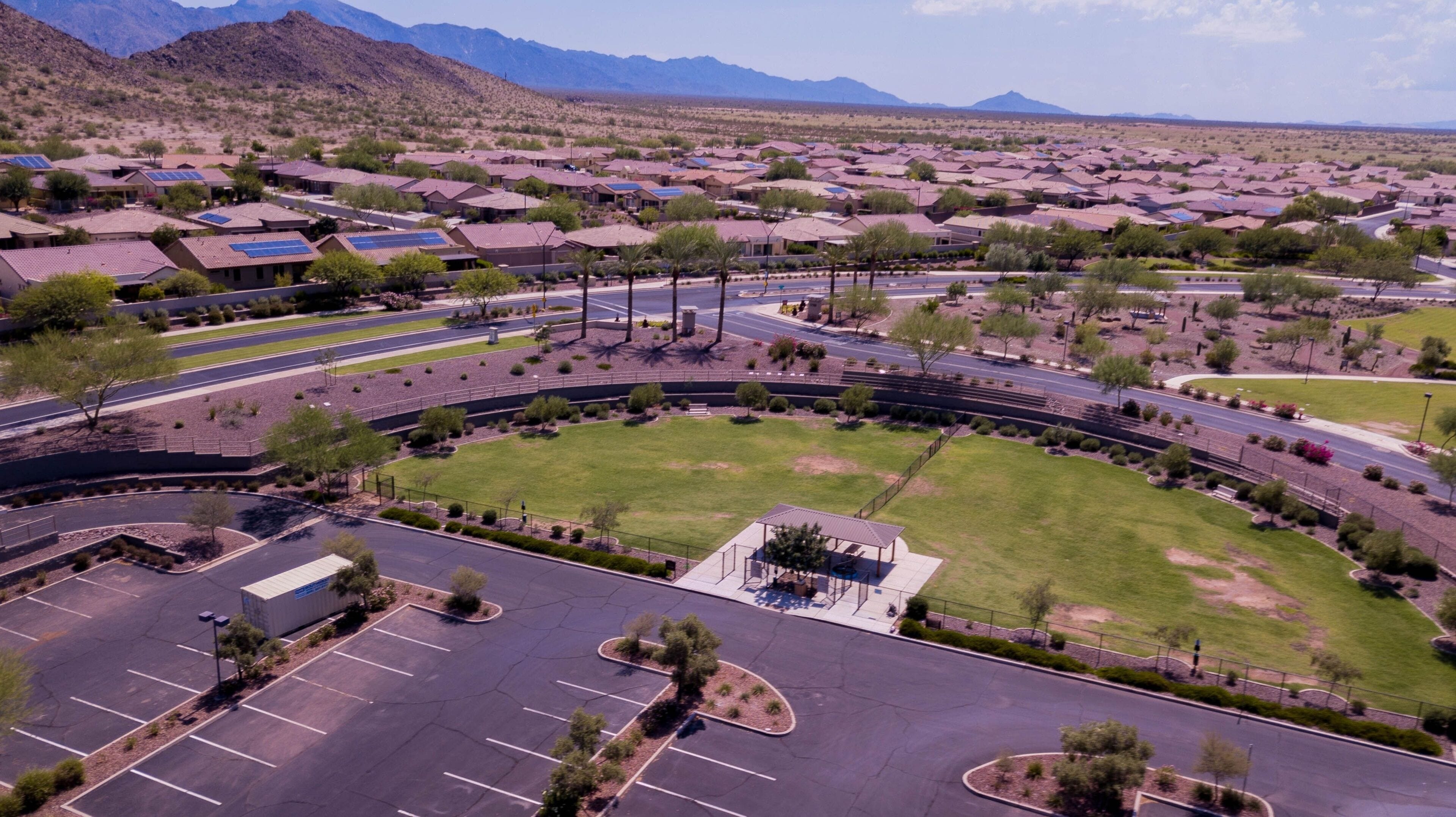 Aerial view of Goodyear, Arizona city with clean asphalt roads, low buildings and green trees