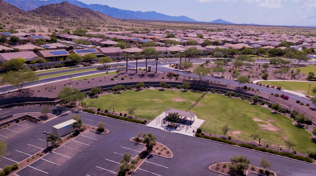 Aerial view of Goodyear, Arizona city with clean asphalt roads, low buildings and green trees