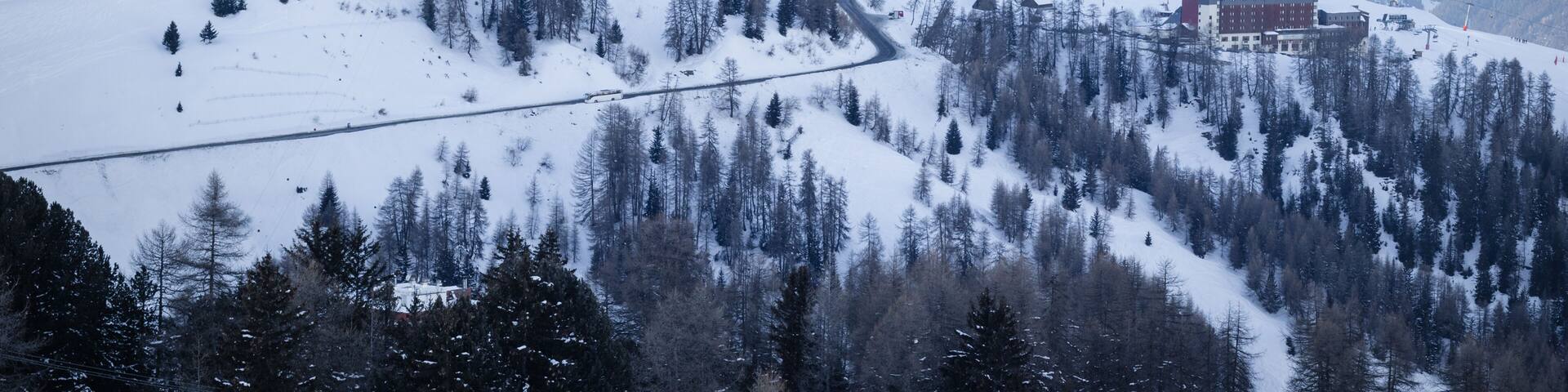 View of La Plagne Aime 2000 ski resort in French Savoy Alps. Snow covered mountains and buildings of ski apartments