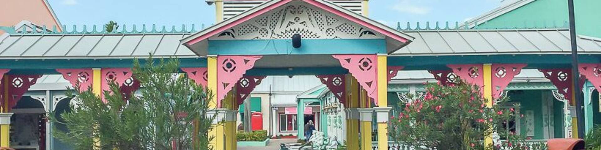 A colorful building with a sign that reads "Port Lucaya."