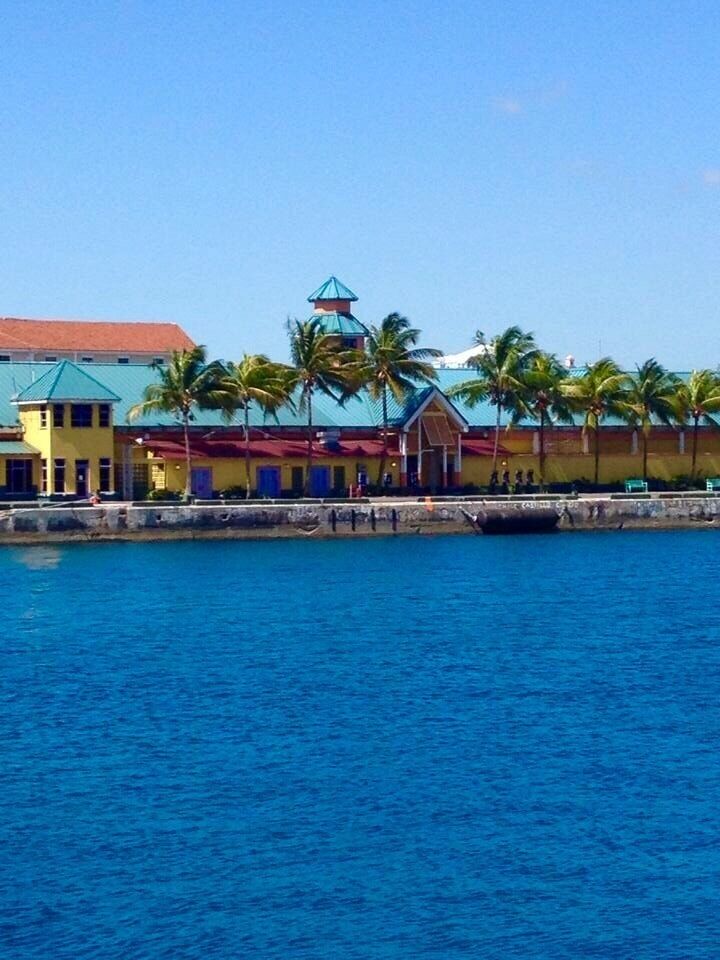 Colorful homes set against the deep blue waters. The Bahamas is a fun destination. #EndlessSummer