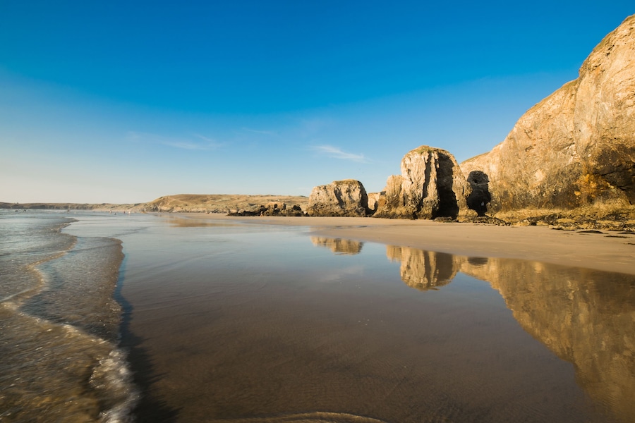An interesting rock formation on Perranporth beach in Cornwall, formed by thousands of years of erosion by the sea. ; Shutterstock ID 1143464531; purchase_order: SP-1332 HA Batch 2 August 2018; Order:
