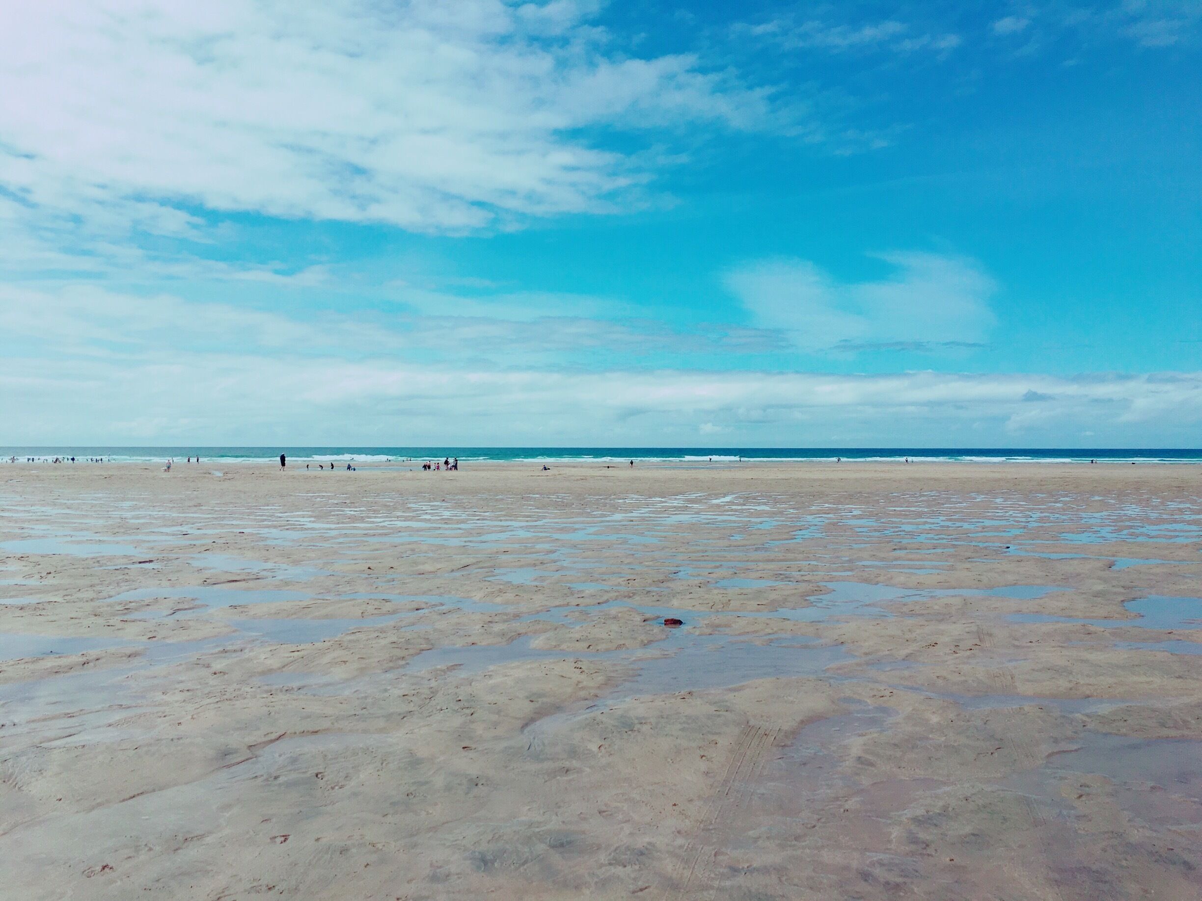 Beautiful blue skies and wet sands at Perranporth beach, Cornwall