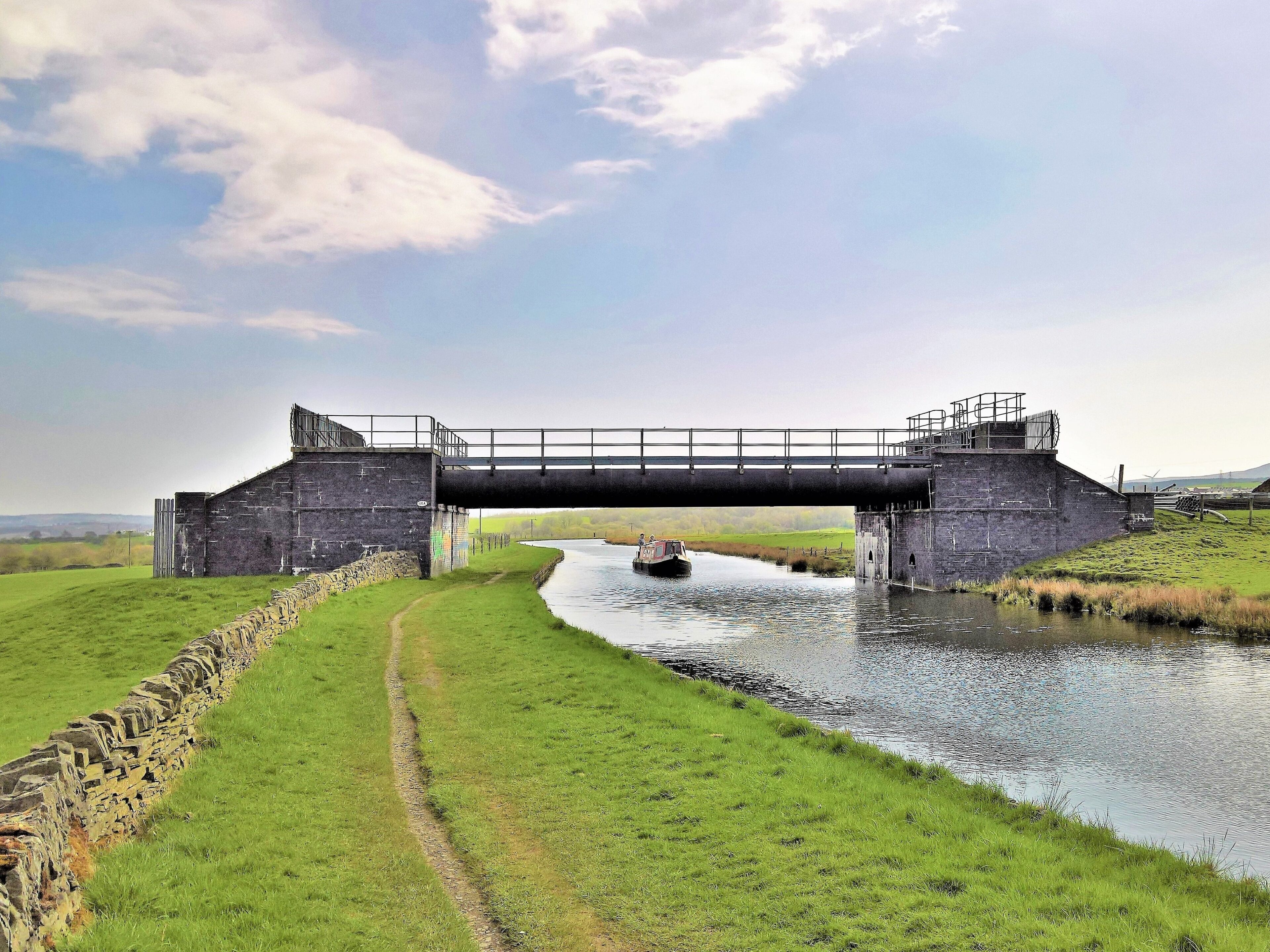 The Leeds and Liverpool Canal at Altham, Lancashire. The 115A pipe bridge.