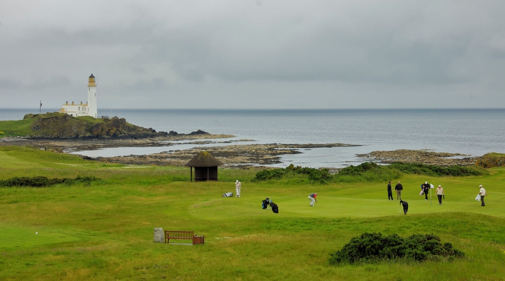 The green on the 11th hole of the Turnberry (Ailsa Craig) course, with a party finishing the hole.