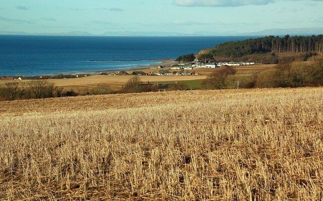 Maidenhead Bay View Looking towards Maidenhead Bay and the caravan site at the end of the beach. Viewed from a barley field above the village on a fine February afternoon.