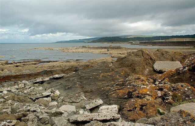 Clyde Coast View Looking up the Clyde coast at Maidens. The harbour wall, still in this square, is on the right. Barwhin Point, in NS2109 is in the middle distance.