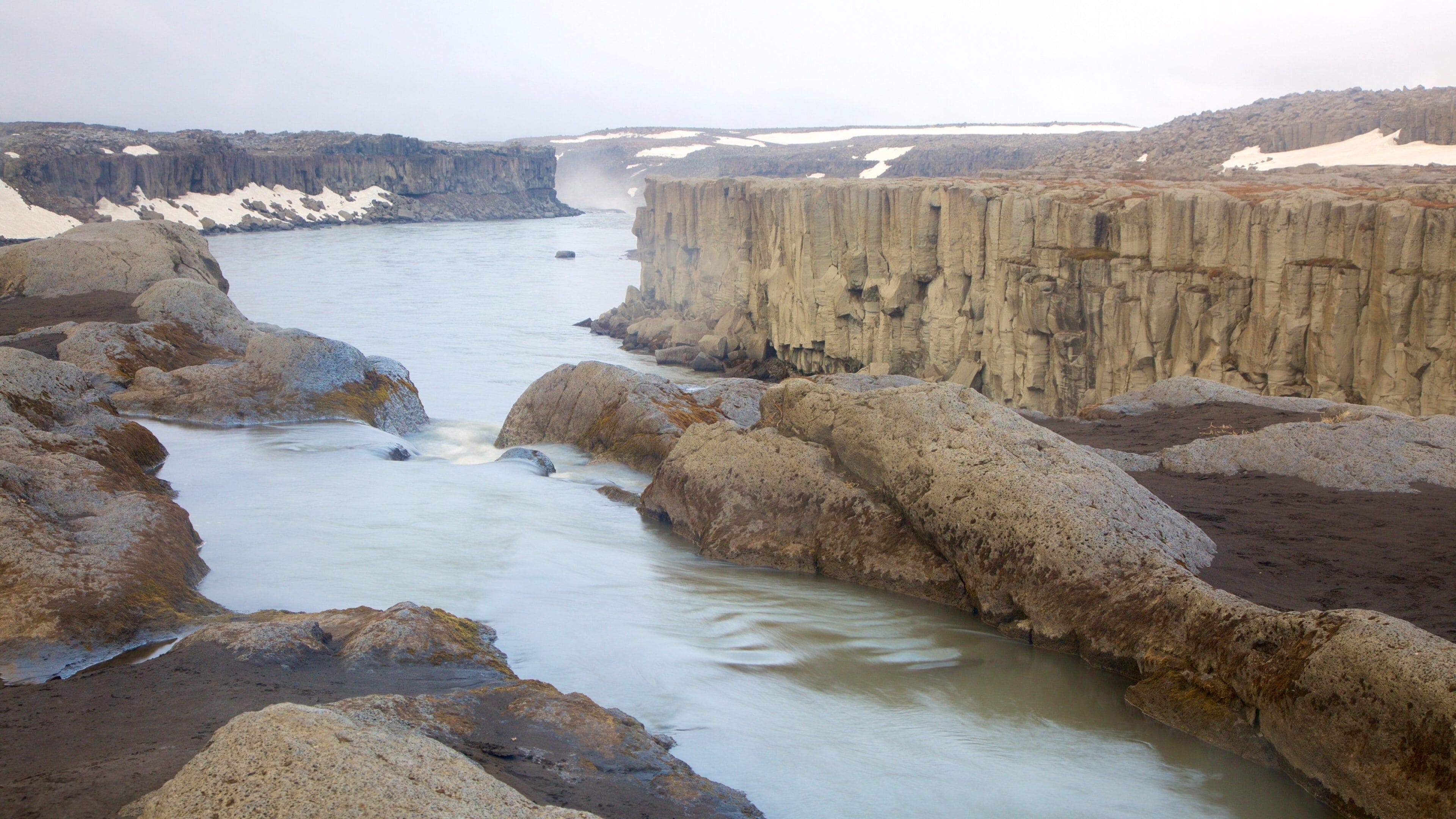 Selfoss which includes a gorge or canyon and a river or creek
