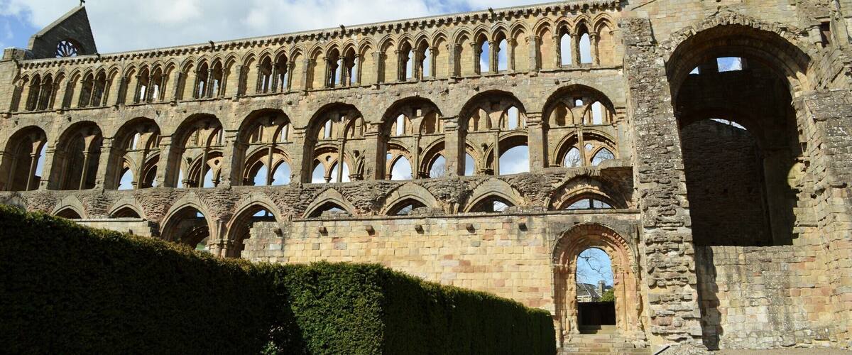 Jedburgh Abbey, a ruined Augustinian abbey which was founded in the 12th century, is situated in the town of Jedburgh, in the Scottish Borders 10 miles (16 km) north of the border with England at Carter Bar. Jedburgh is the largest town on the A68 between Newcastle upon Tyne and the Scottish capital, Edinburgh