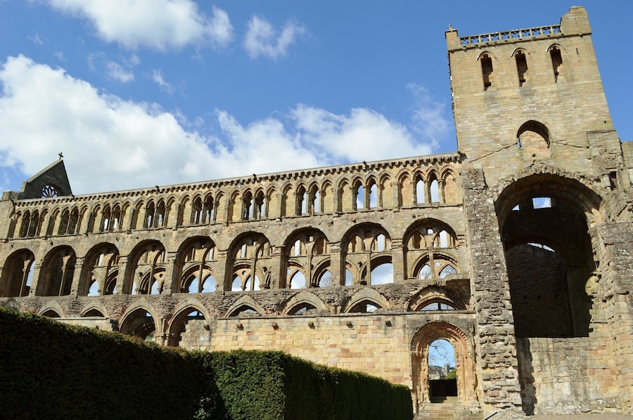 Jedburgh Abbey, a ruined Augustinian abbey which was founded in the 12th century, is situated in the town of Jedburgh, in the Scottish Borders 10 miles (16 km) north of the border with England at Carter Bar. Jedburgh is the largest town on the A68 between Newcastle upon Tyne and the Scottish capital, Edinburgh