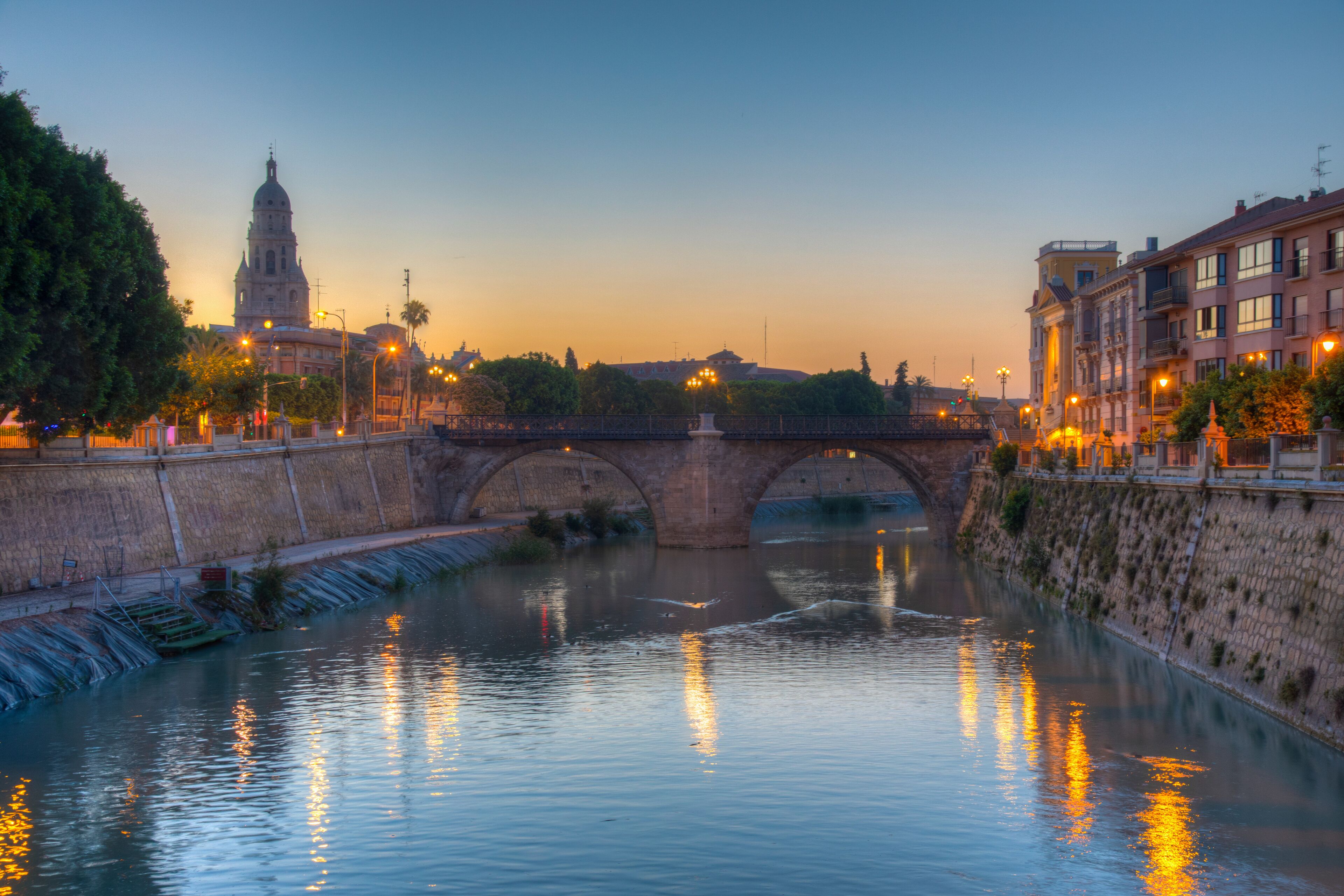 Riverside of Segura with cathedral and Puente de los peligros in Murcia, Spain