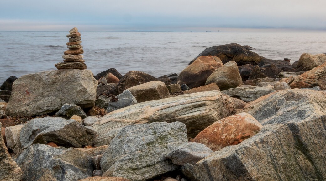 Stone cairn on the ocean shore in Connecticut, USA, near Harkness Memorial State Park
