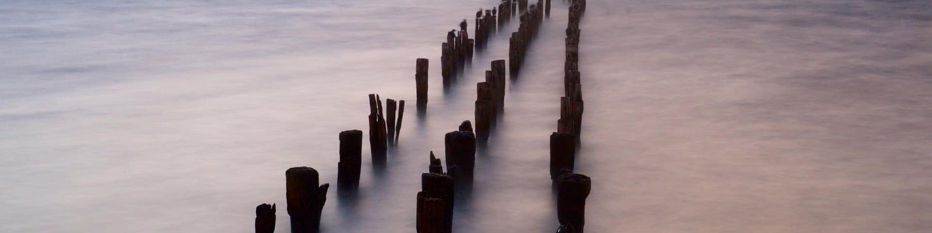 Puerto Natales which includes landscape views, a sunset and a lake or waterhole