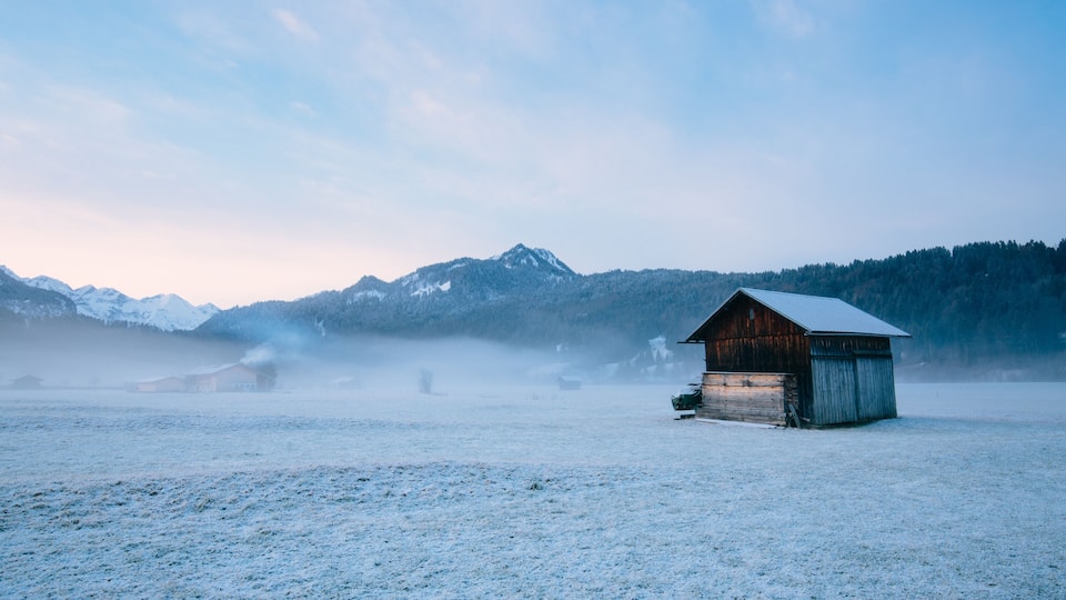 Footsteps on the snow and a house in the mountains in frosty foggy morning, Oberstdorf Germany; Shutterstock ID 368394050; Purchase Order: -