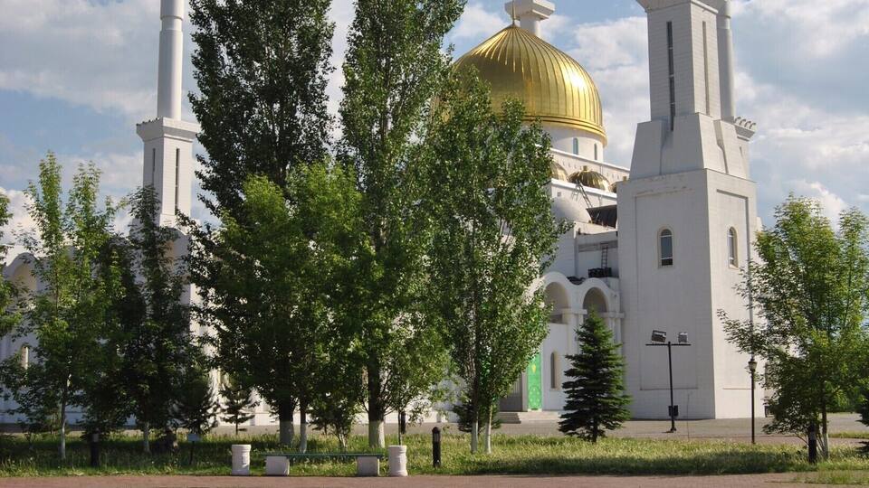 The Nur Astana mosque - beautiful in all seasons but especially with its green tree friends under blue skies.