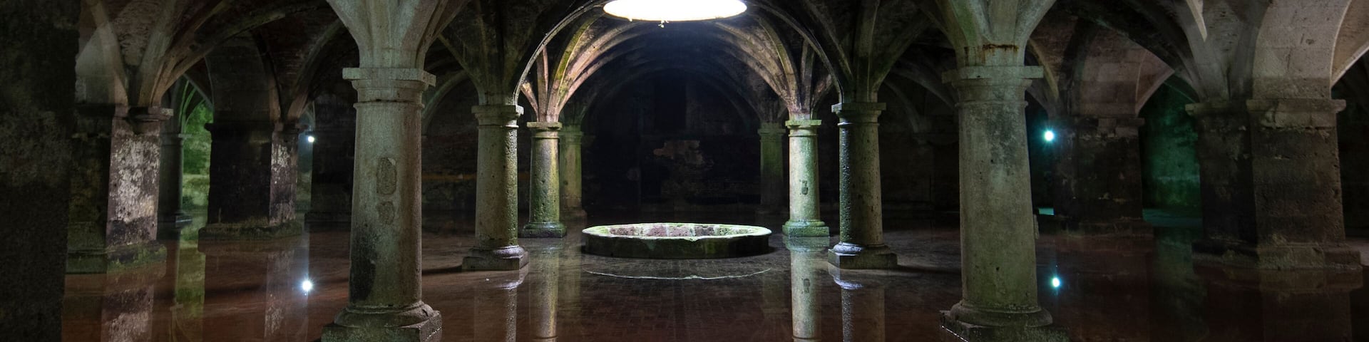 EL JADIDA, MOROCCO. The old Manueline Cistern with reflection. Sunlight beam in darkness, dark room on ground floor in Portuguese Cisterns.