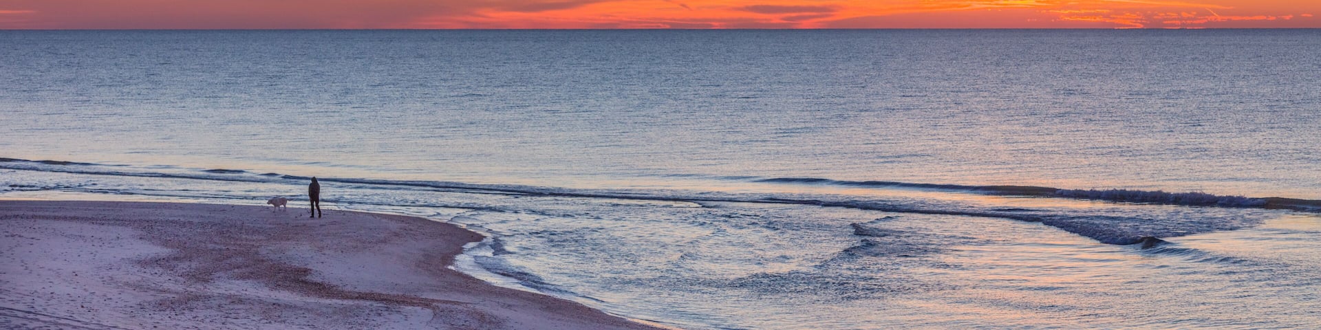 Sunrise over Gulf of Mexico on St George Island in the panhandle or forgotten coast area of Florida in the United States