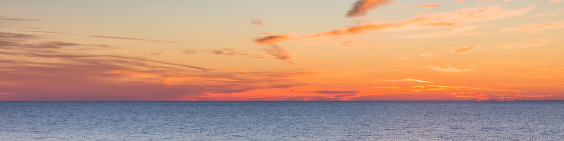 Sunrise over Gulf of Mexico on St George Island in the panhandle or forgotten coast area of Florida in the United States