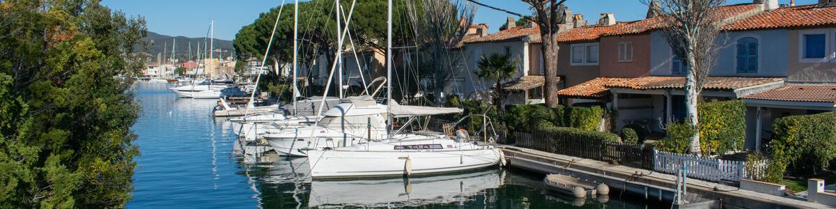 Port Cogolin house on river shore with yachts