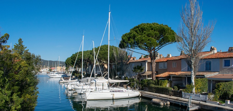 Port Cogolin house on river shore with yachts