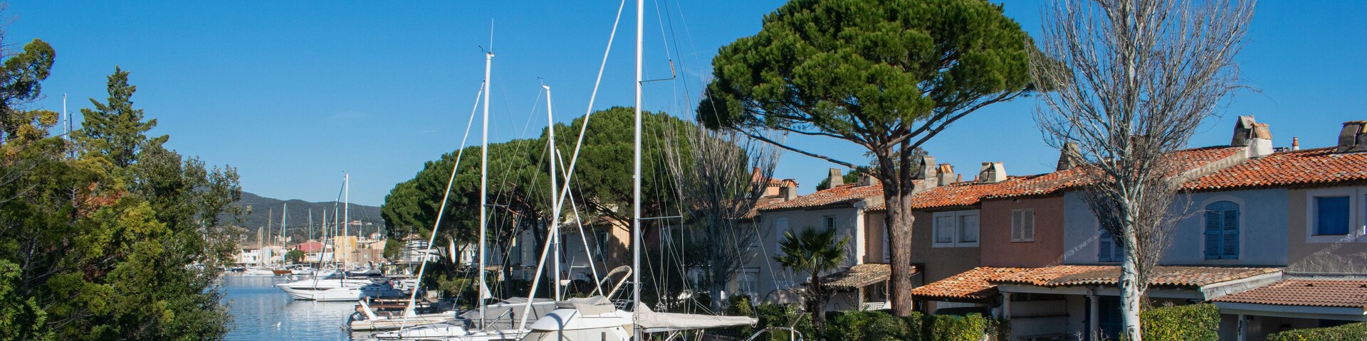 Port Cogolin house on river shore with yachts