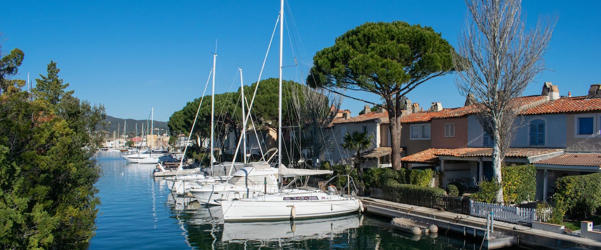 Port Cogolin house on river shore with yachts
