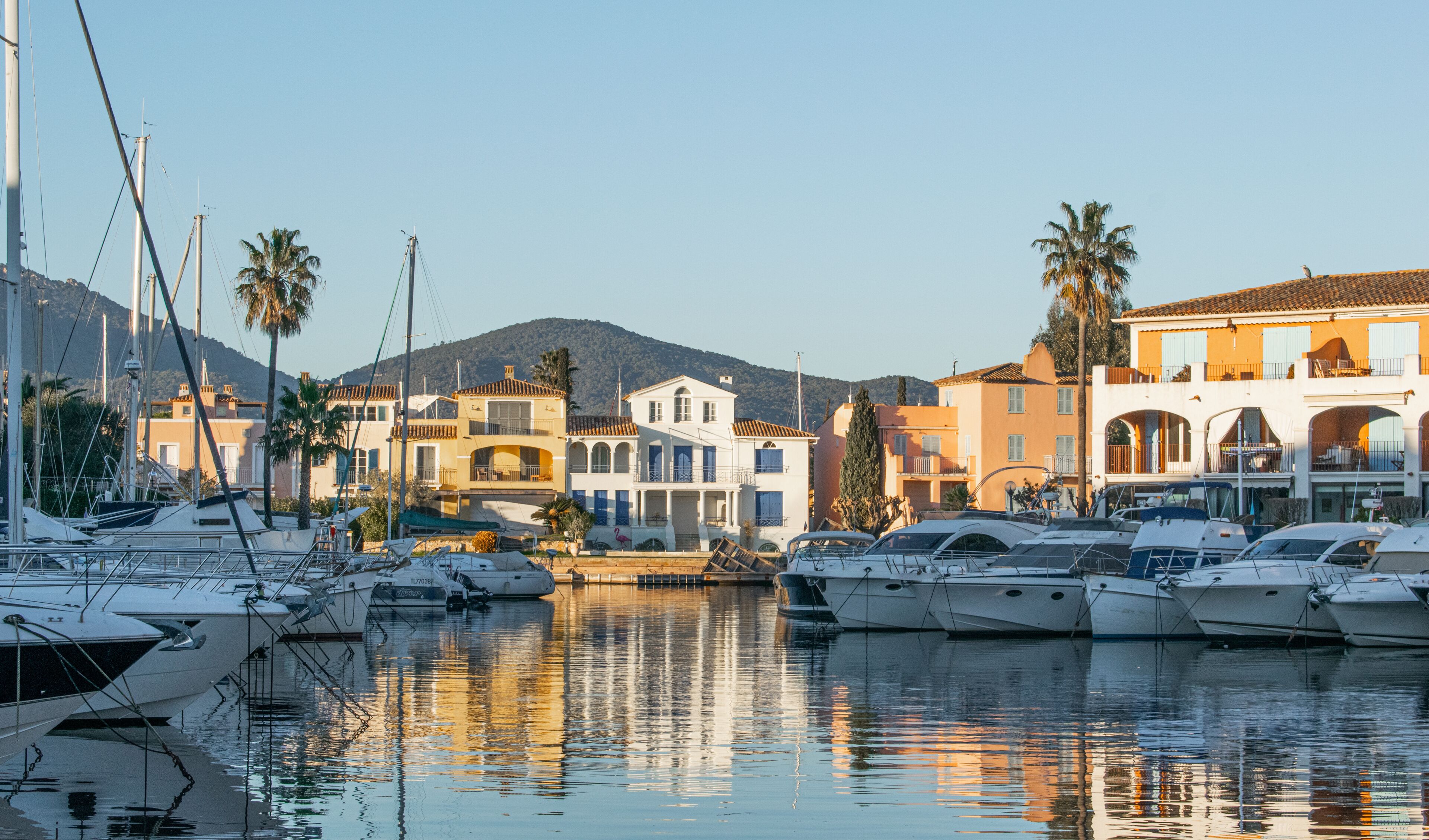 Port Cogolin house on river shore with yachts