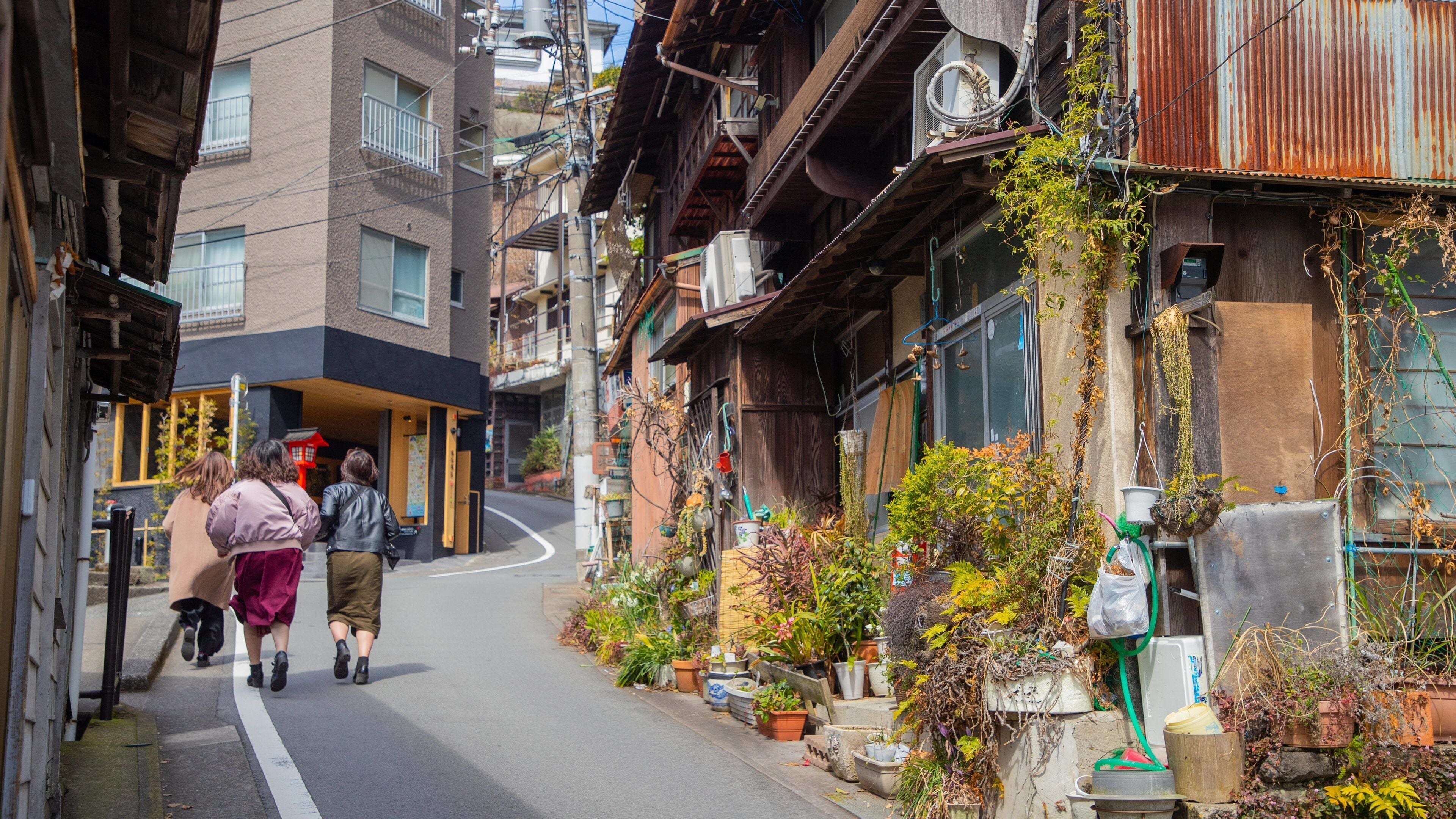 Atami featuring street scenes as well as a small group of people