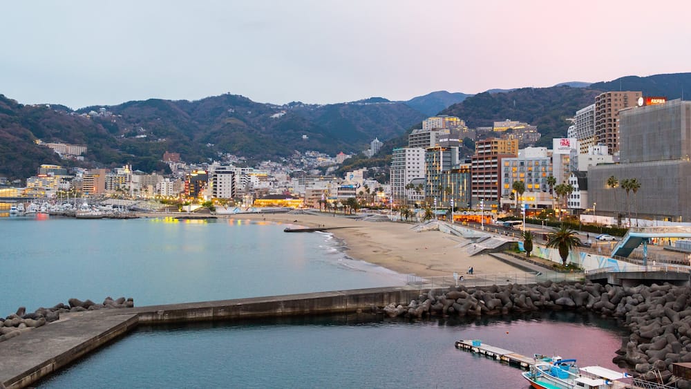 Atami featuring a bay or harbor and a coastal town